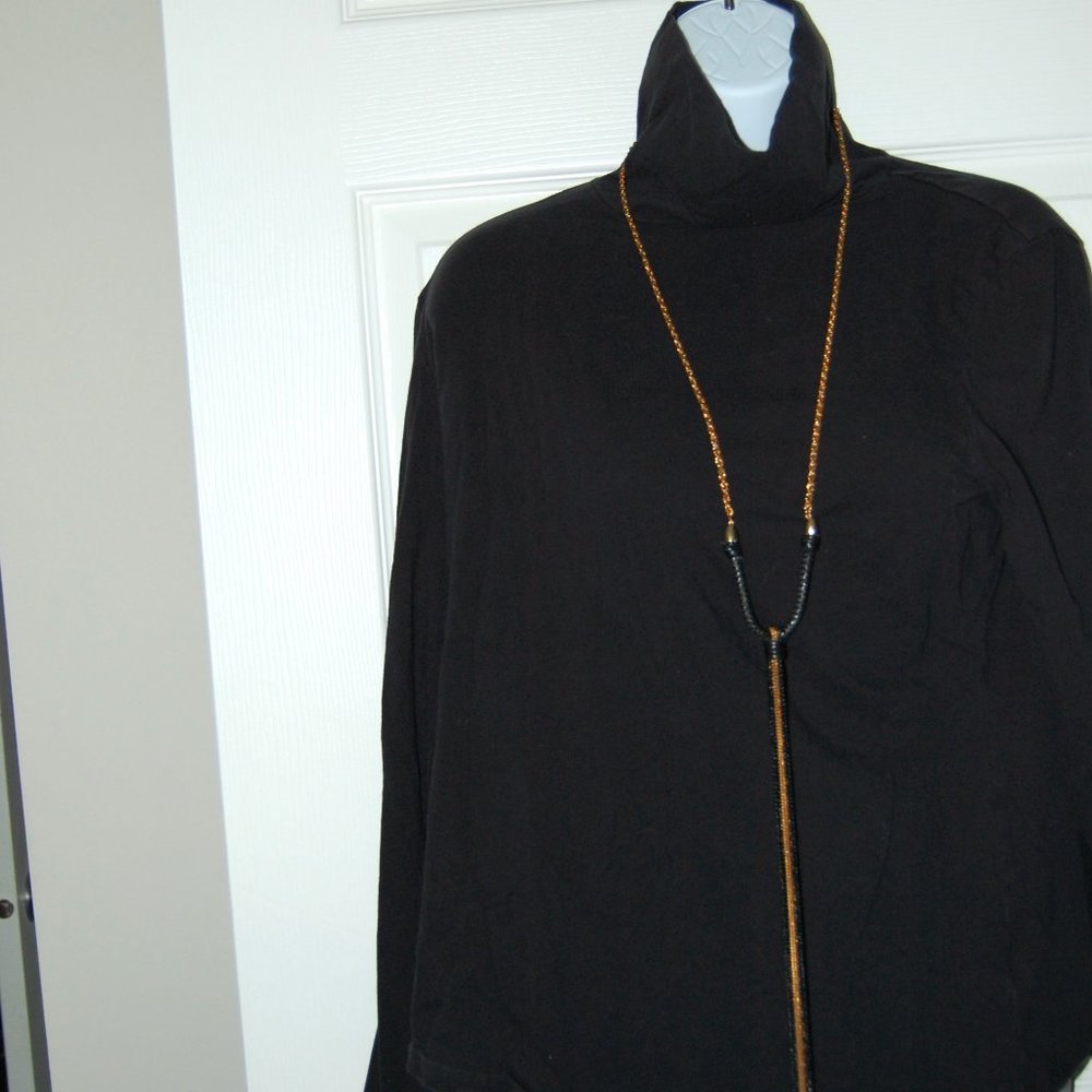 Long gold tone necklace with black/gold chains